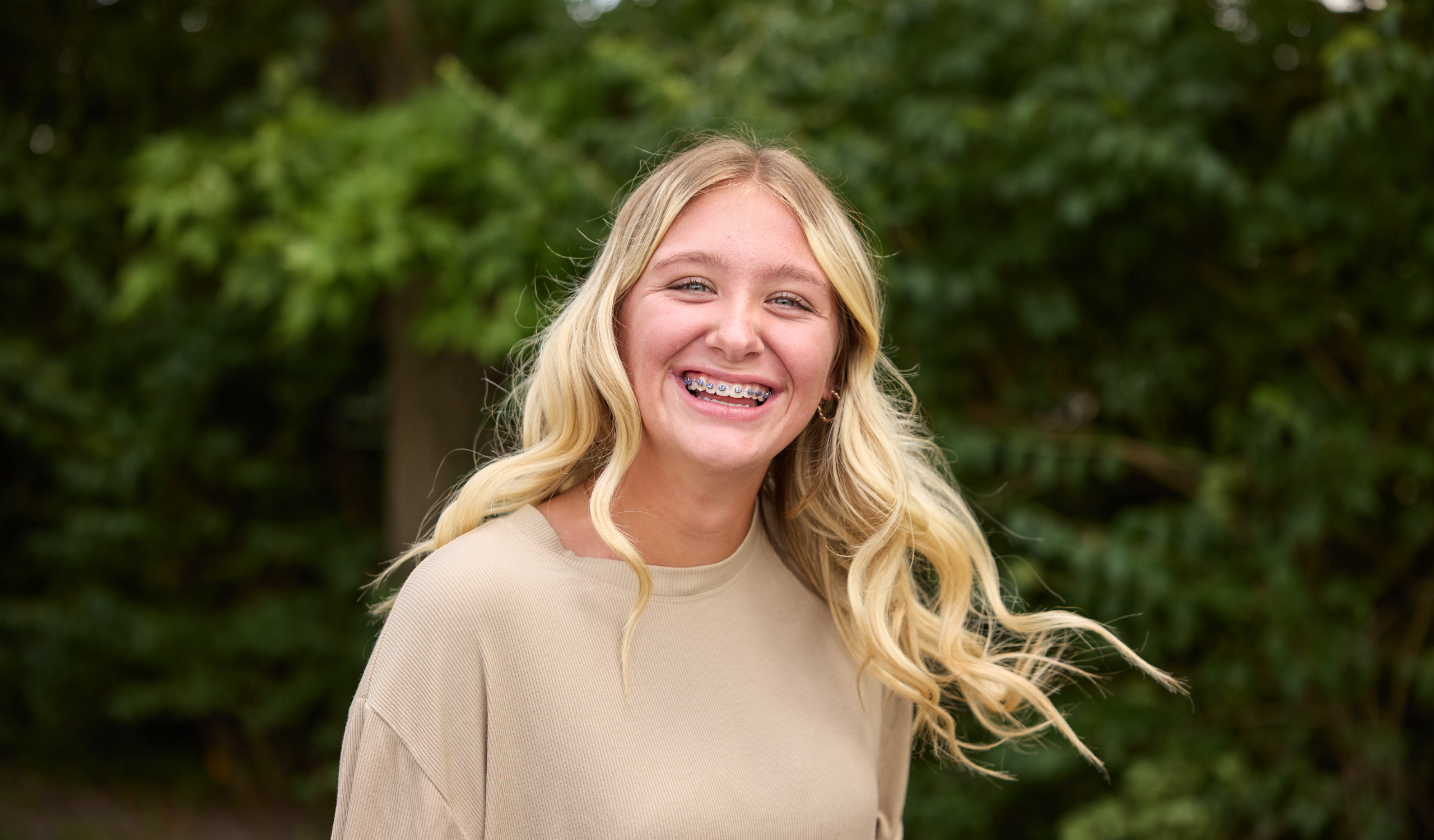 girl with blonde hair smiling