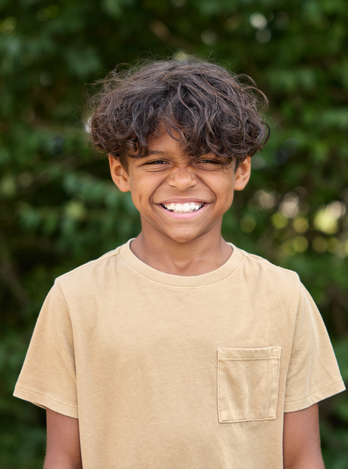 Boy smiling with big bright smile