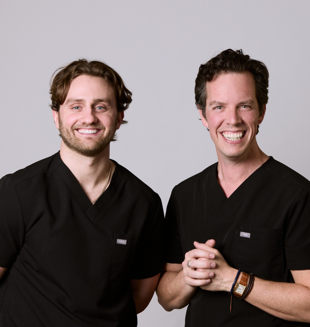 Two men smiling at Rochford Orthodontics.