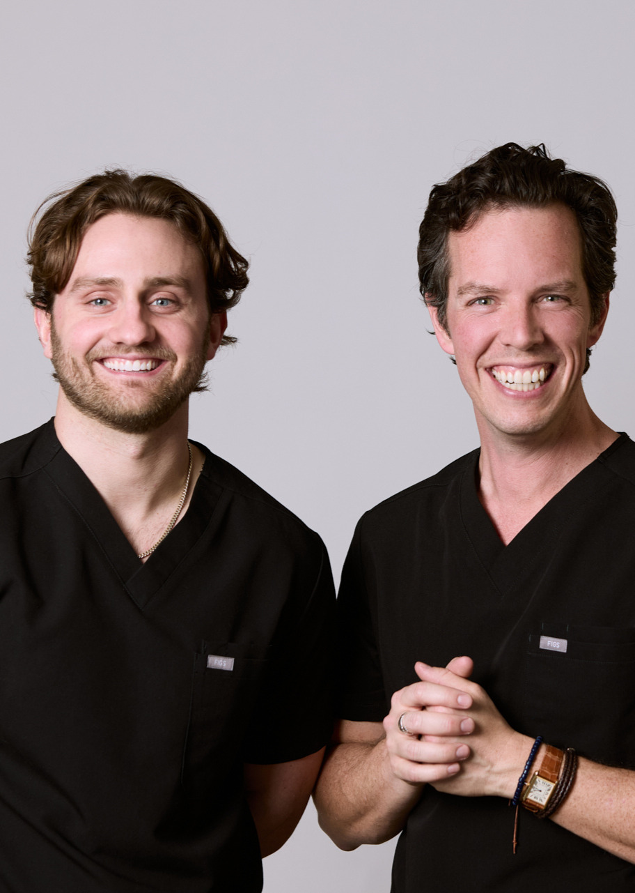 Two men smiling at Rochford Orthodontics.