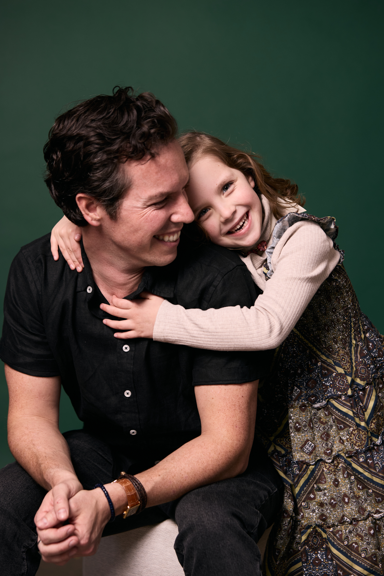 Father and daughter hugging at Rochford Orthodontics.