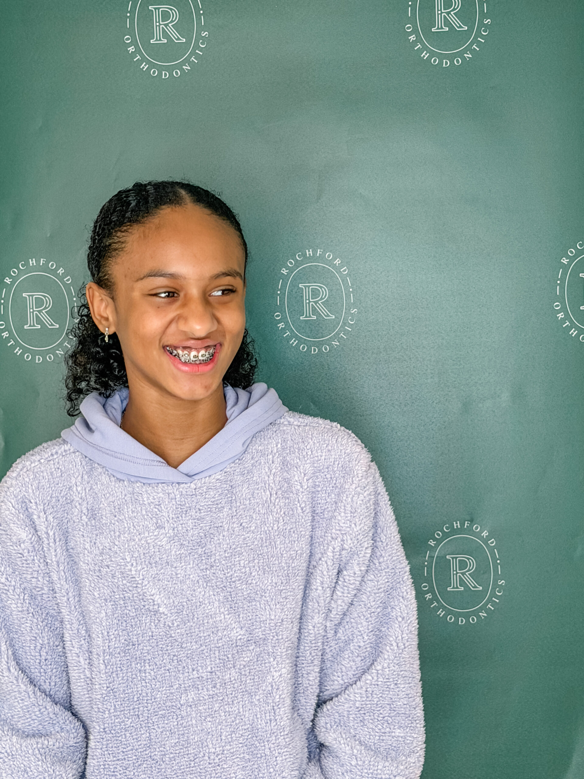 Young girl smiling with braces at Rochford Orthodontics.