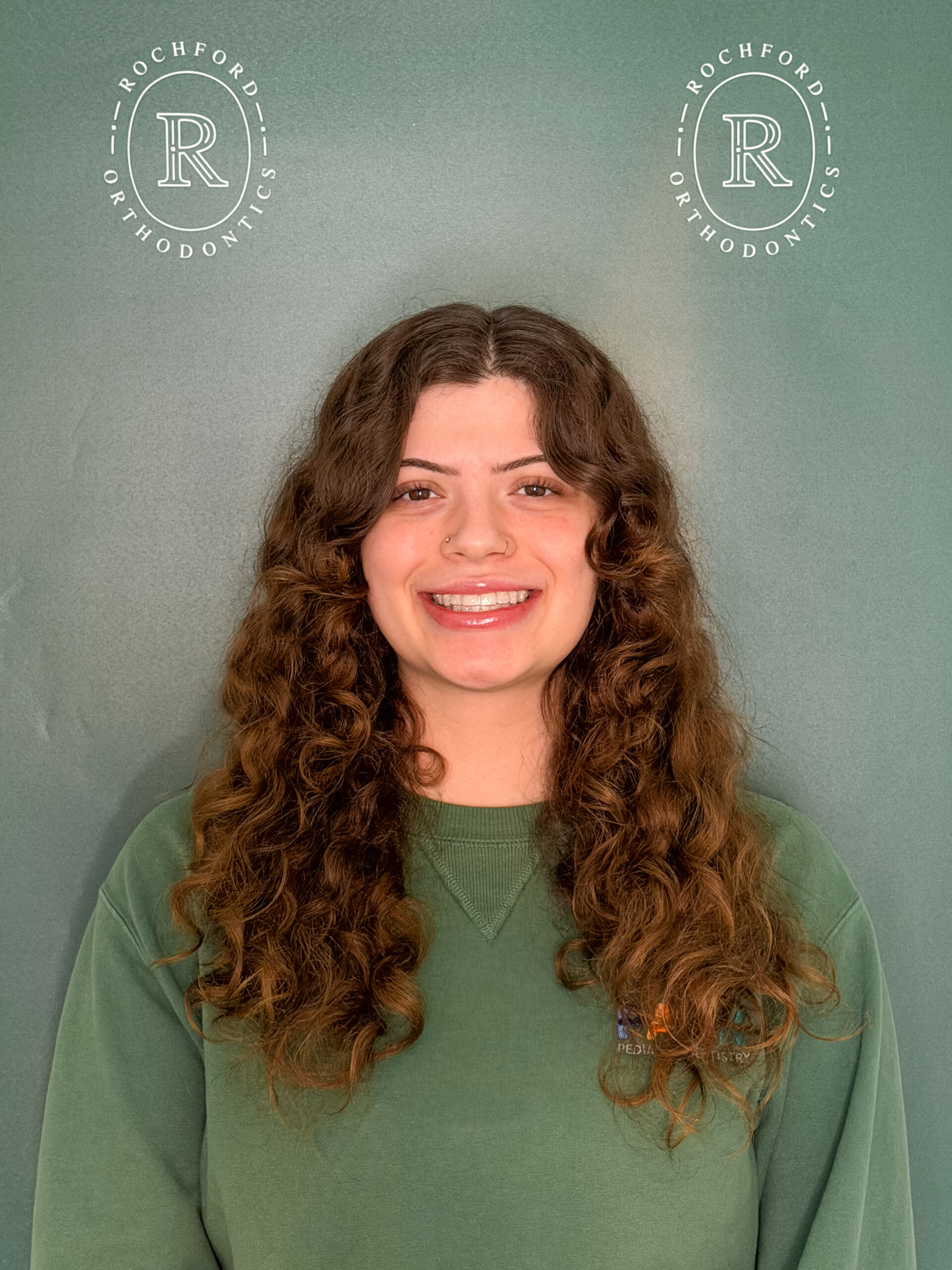 Girl smiling with braces at Rochford Orthodontics.