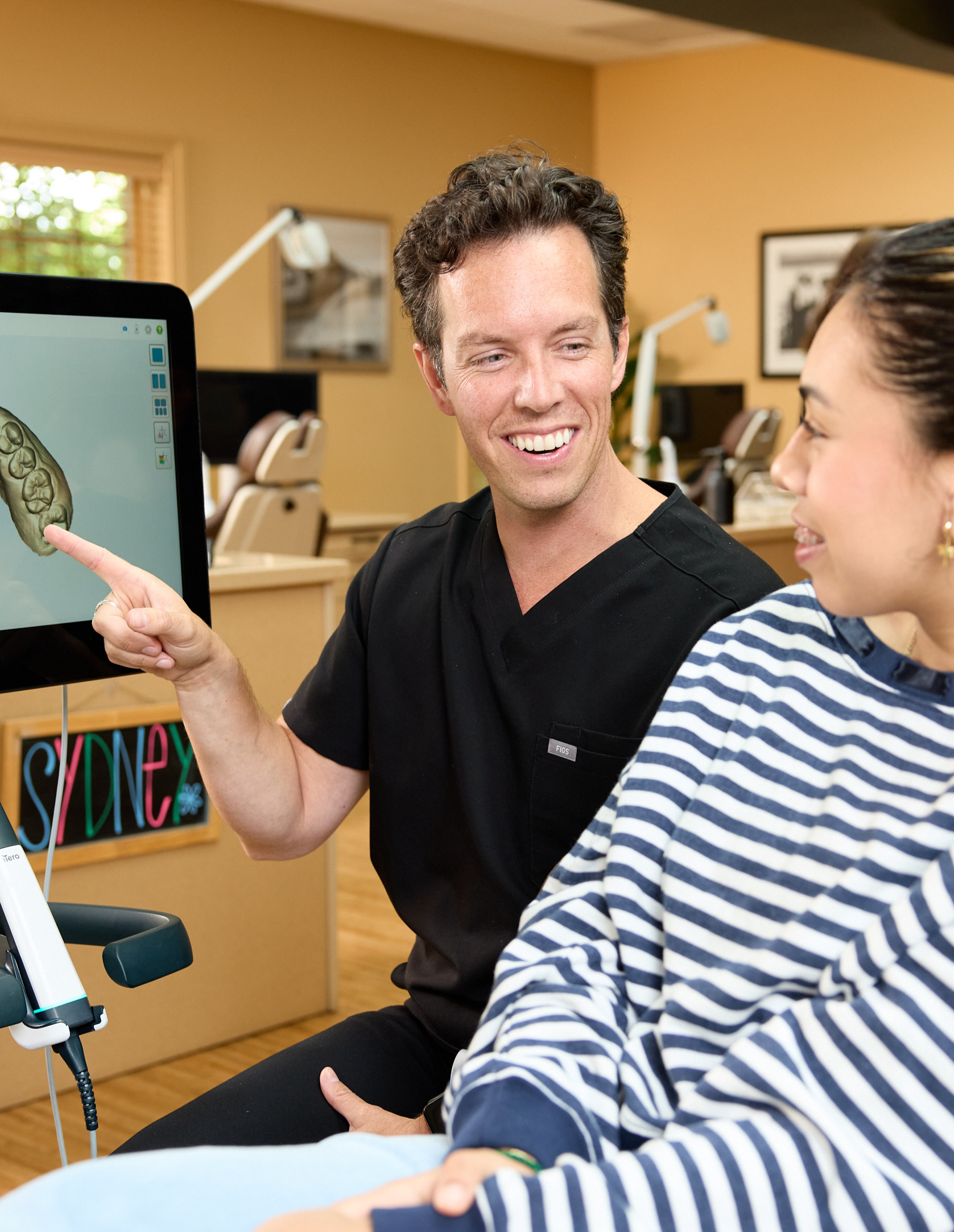 Doctor and patient looking at a digital tooth scan at Rochford Orthodontics.