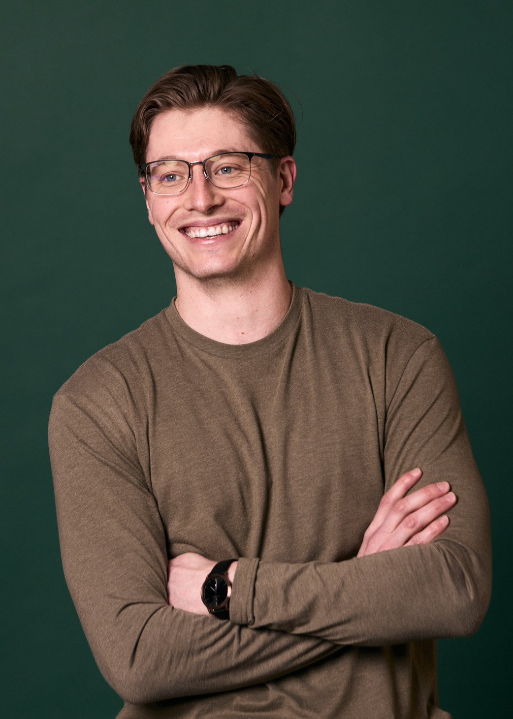 Man in glasses smiling at Rochford Orthodontics.